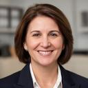 Linda B. smiling in a professional office portrait with a neutral background